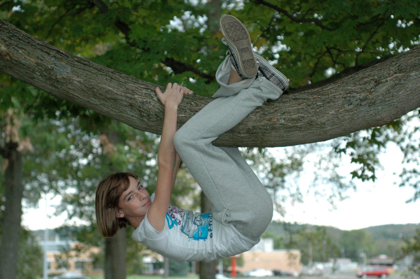 girl_hanging_from_a_tree